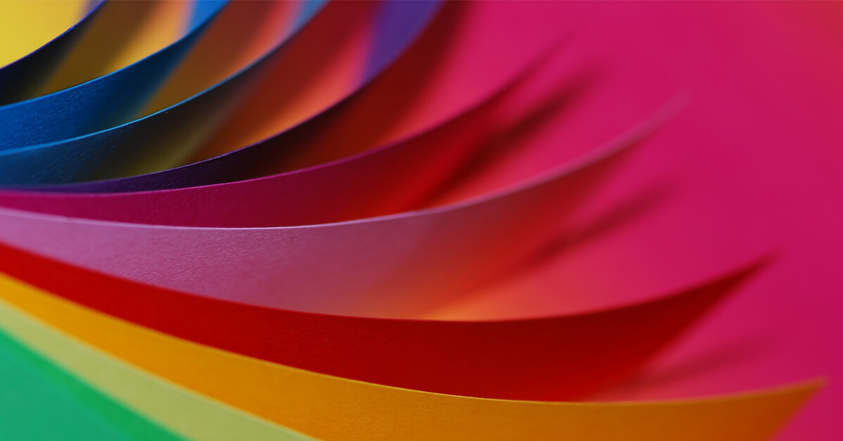 Colored Papers Against a Pink Background