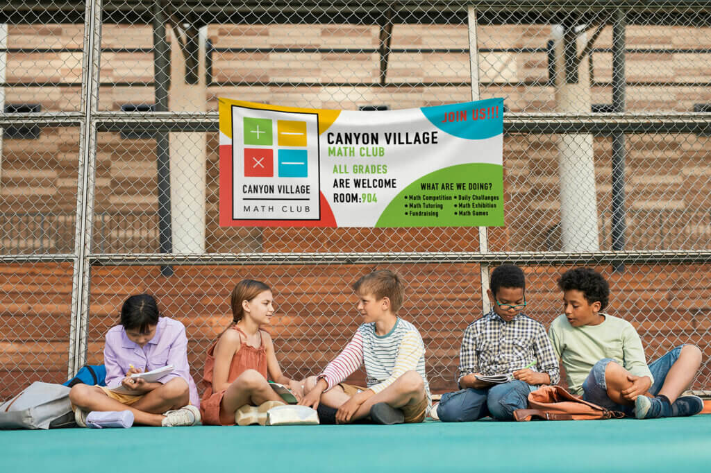 Children studying together under a Math Club banner