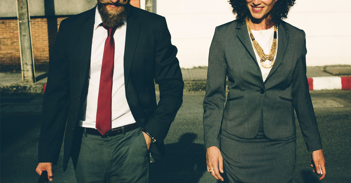 Two Business People Walking Towards the Camera